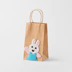 https://s3-ap-southeast-2.amazonaws.com/fusionfactory.commerceconnect.bbnt.production/pim_media/000/204/283/M_F_Easter26_Paper-Bag-w-Girl-Bunny_Blue_26640401_SI.jpg?1762926141