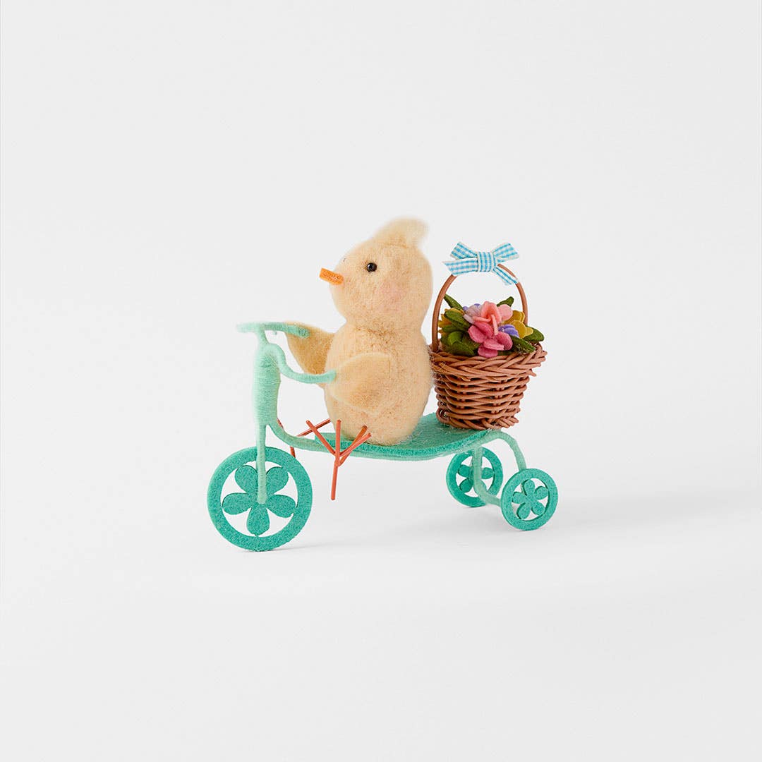 https://s3-ap-southeast-2.amazonaws.com/fusionfactory.commerceconnect.bbnt.production/pim_media/000/204/893/M_F_Easter26_T2-Chick--on-Bike-w-Basket_Yellow-Blue_26616201_SI.jpg?1764129769