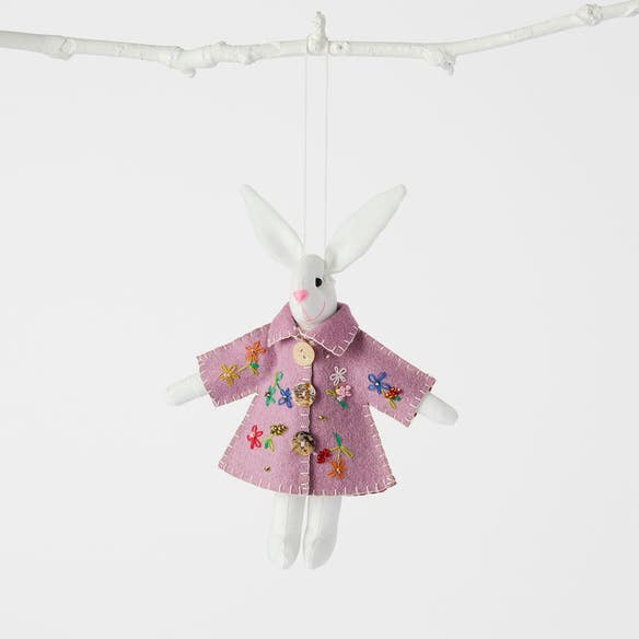 https://s3-ap-southeast-2.amazonaws.com/fusionfactory.commerceconnect.bbnt.production/pim_media/000/204/952/M_F_Easter26_T2-Handmade-Rabbit-in-Coat-w-Flowers_Purple-White_26617701_SI.jpg?1764134774