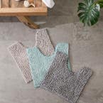 https://s3-ap-southeast-2.amazonaws.com/fusionfactory.commerceconnect.bbnt.production/pim_media/000/174/521/M_F_S24-25_Summer_LS_Studio_Bathmats-Bobble_Melange_Contour_Mat-Charcoal_SI.jpg?1730151685