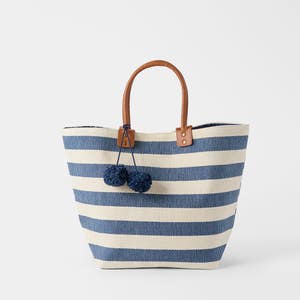 https://s3-ap-southeast-2.amazonaws.com/fusionfactory.commerceconnect.bbnt.production/pim_media/000/219/222/M_F_S26-27_Striped-Tote-w-Pom-Pom_Blue-White_20227801_SI.jpg?1786688204