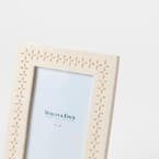 https://s3-ap-southeast-2.amazonaws.com/fusionfactory.commerceconnect.bbnt.production/pim_media/000/205/743/M_F_W26_Dune-Resin-Frame-5x7_Ivory_26906401_Detail_SI.jpg?1765344477