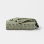 https://s3-ap-southeast-2.amazonaws.com/fusionfactory.commerceconnect.bbnt.production/pim_media/000/209/322/M_F_W26_Emmie-Knitted-Throw_Seagrass_26938104_SI.jpg?1770773264