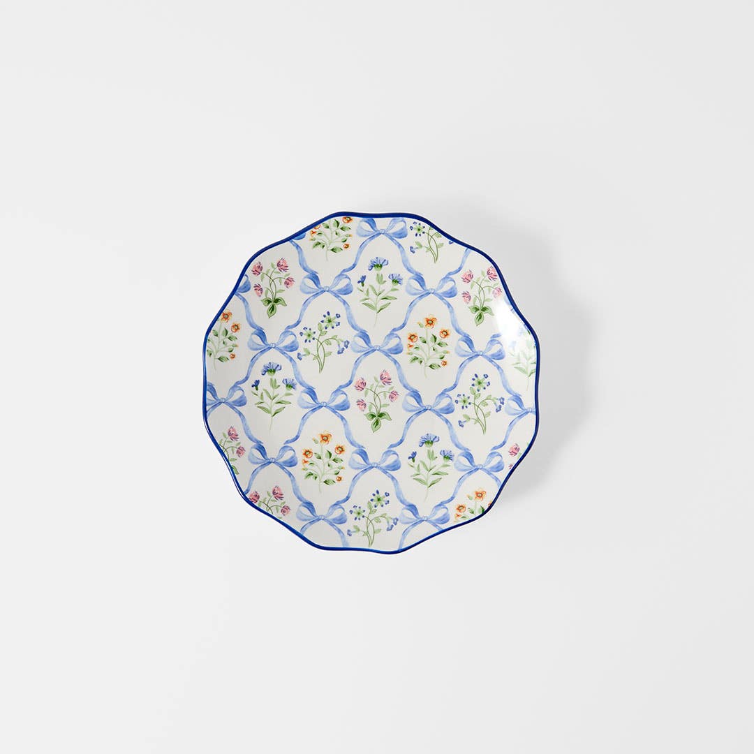 https://s3-ap-southeast-2.amazonaws.com/fusionfactory.commerceconnect.bbnt.production/pim_media/000/206/439/M_F_W26_Floral-Bow-Side-Plate_Blue_26854001_SI.jpg?1767156933