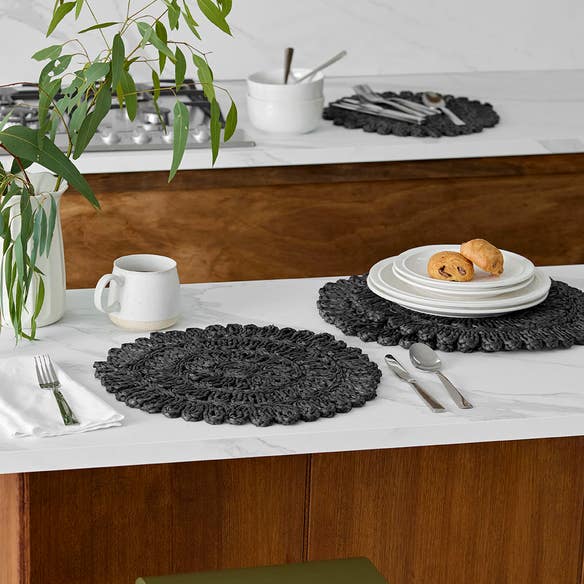 https://s3-ap-southeast-2.amazonaws.com/fusionfactory.commerceconnect.bbnt.production/pim_media/000/210/495/M_F_W26_Studio_LS_Napery_Placemats_Fancy_Florette_Centre_Pattern-Black_SI.jpg?1772503774