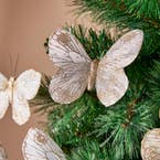 https://s3-ap-southeast-2.amazonaws.com/fusionfactory.commerceconnect.bbnt.production/pim_media/000/213/428/M_F_Xmas-26-27_HT_Decs_Set_S6-Feather-Butterfly-on-Clip-Ivory-Gold_22168401_Detail_SI.jpg?1778825831