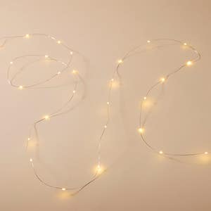 https://s3-ap-southeast-2.amazonaws.com/fusionfactory.commerceconnect.bbnt.production/pim_media/000/222/526/M_F_Xmas-26-27_HT_GARLAND_LED-Glisten-String-Lights-6m-Silver_17334401_V2_SI.jpg?1789624131