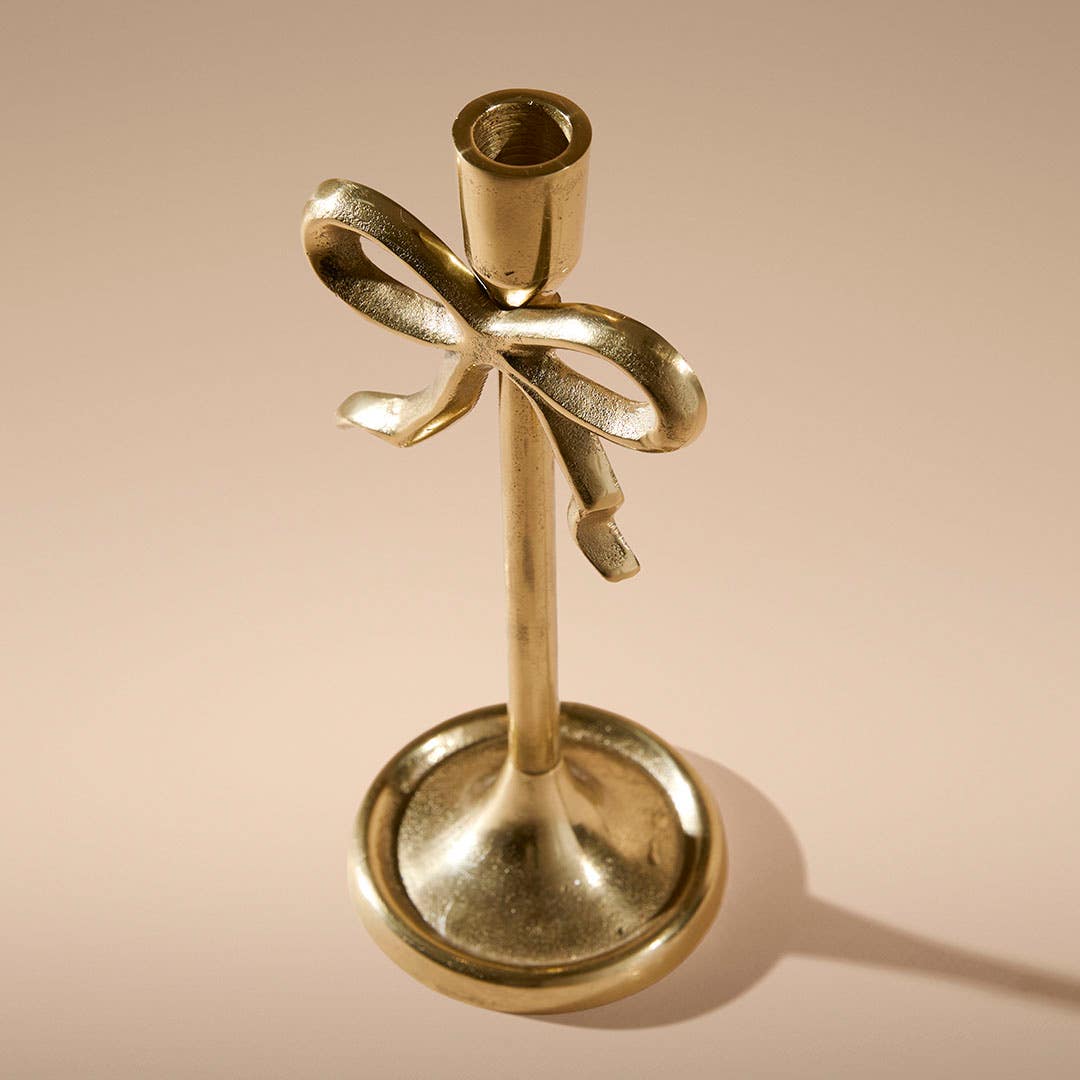 https://s3-ap-southeast-2.amazonaws.com/fusionfactory.commerceconnect.bbnt.production/pim_media/000/214/665/M_F_Xmas-26-27_MR_CANDLEHOL_Bow-Taper-Candle-Holder_27038501_SI.jpg?1781503403