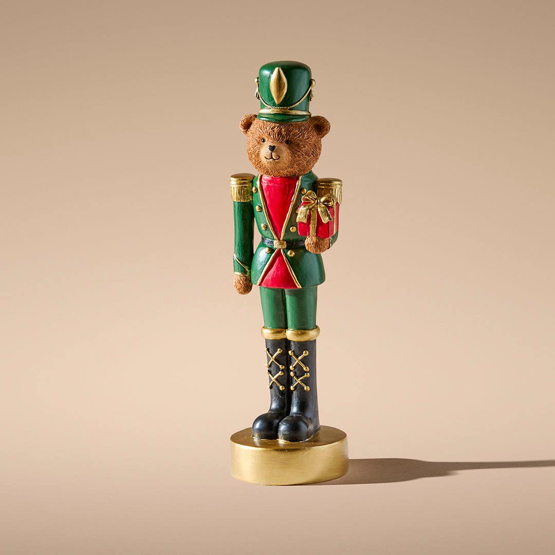 https://s3-ap-southeast-2.amazonaws.com/fusionfactory.commerceconnect.bbnt.production/pim_media/000/214/713/M_F_Xmas-26-27_MR_STAND_DECS_Resin-Bear-Nutcracker-w-Gift_27036701_SI.jpg?1781504832