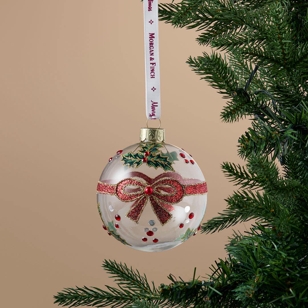 https://s3-ap-southeast-2.amazonaws.com/fusionfactory.commerceconnect.bbnt.production/pim_media/000/217/325/M_F_Xmas-26-27_S4_MR_DECS_Glass-Ball-w-Holly-_-Bow_27063301_SI.jpg?1784079387